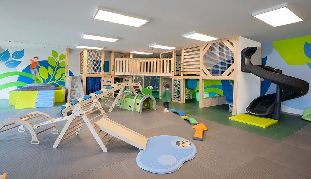 Toddlers enjoying STEM toys and active play at The Playroom East Cobb indoor playground in Marietta